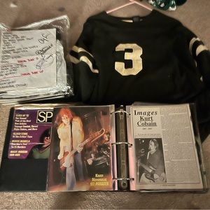 Signed Nirvana paper line up and Kurt Cobain’s Number 3 Sweater and Memorabilia